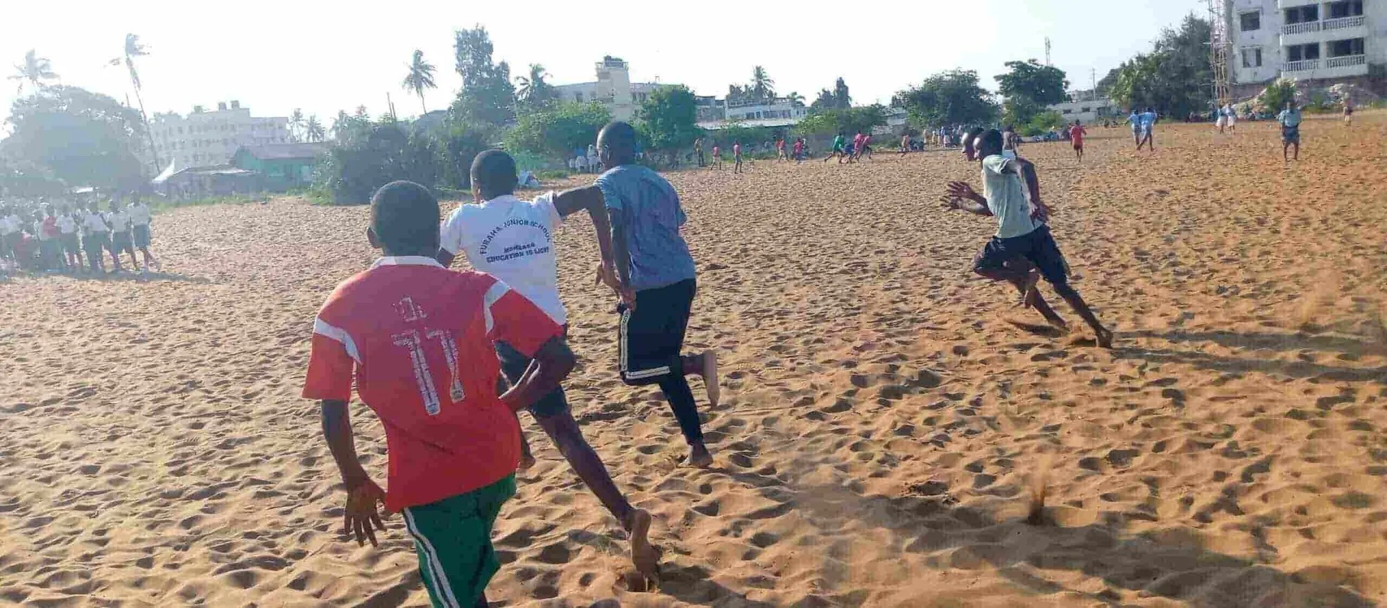 Teacher and boys running